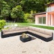 L-shaped outdoor wicker conversation set with beige cushions, featuring a tempered glass tabletop for stylish patio.