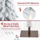 Snow-flocked branches of a 6 feet pre-lit slim pencil Christmas tree with a sturdy metal plate base for stability.