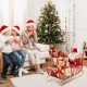 Large red metal Christmas Santa sleigh with curled edges and golden accents, ideal for holding gifts and festive decor.