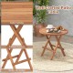 Round patio folding coffee table made of teak wood with slatted tabletop, ideal for picnics and camping.
