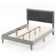 Full-size platform bed with high velvet headboard and wooden slats, designed for stability and comfort.