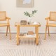 Bamboo side table with glass top and rattan shelf, perfect for living room or bedroom use, featuring a modern design.