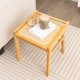 Bamboo vanity stool with faux rattan top, featuring reinforcement bars and non-slip foot pads for stability and comfort.