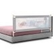 Vertical lifting baby bed rail with cute pattern, adjustable height, and double safety lock for secure use.