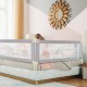 Vertical lifting baby bed rail with cute pattern, adjustable height, and safety lock, designed for various bed types.