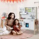 Wooden pretend play kitchen set in white with microwave, oven, and accessories, perfect for toddlers' imaginative play.
