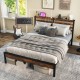 Queen size bed frame with storage headboard and charging station, featuring robust metal legs and under-bed storage.