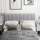 Gray linen upholstered headboard with vertical channel tufting and solid wood legs, perfect for full or queen size beds.