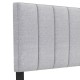 Gray linen upholstered headboard with vertical channel tufting and solid wood legs, designed for full and queen size.