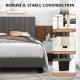 Queen size upholstered bed frame with gray vertical channel tufted headboard and solid wood legs for stability.