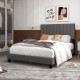 Gray queen size upholstered bed frame featuring a vertical channel tufted headboard and cozy bedding, ideal for stylish.
