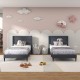 Twin size upholstered platform beds with button tufted gray headboards, ideal for stylish bedroom or guest room decor.