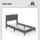 Twin size upholstered platform bed in gray with button tufted headboard and solid wood legs, ideal for bedroom or dorm.