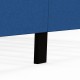 Close-up of the solid wood leg of the blue upholstered platform bed, providing stability and support for bedroom use.