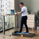 Under desk walking pad treadmill with remote control, featuring a 7-layer running belt for home or office use.