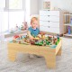 Wooden train set with 84 pieces on a reversible tabletop, designed for kids' play, study, and creativity.