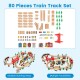 80-piece wooden train set with tracks, buildings, and accessories for imaginative play and fine motor skill development.