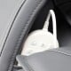 Close-up of the remote control stored in the side pocket of the Provox 27-Comfort 2D Massage Chair in gray.