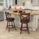 Set of 2 24-inch swivel bar stools with soft cushion and elegant hollow backrest, perfect for kitchen or dining room.