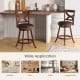 Set of 2 24-inch swivel bar stools with soft cushions and elegant hollow backrests, perfect for kitchen or café use.