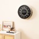 Silent wall clock with silver frame and decorative numbers, perfect for adding elegance to any room decor.
