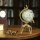 5-inch antique world globe with a golden triangle metal stand, ideal for educational use and indoor decor.