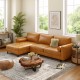 Chaise lounge side of a brown L-shaped sectional sofa with tufted air leather, offering ample seating for comfort.