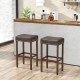 Set of 2 gray upholstered bar stools with footrests, featuring natural rubber wood legs for durability and comfort.