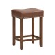 Saddle-shaped 24-inch brown PU leather bar stool with rubber wood legs and footrest, ideal for kitchens and dining.