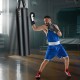 Boxer training with the 4-In-1 Hanging Punching Bag Set, featuring durable PU leather and protective gloves for.