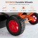 Close-up of 6.5-inch durable wheels on an orange snow shovel, designed for all-terrain use and secure traction.
