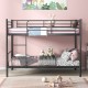 Black metal bunk bed with ladder and guardrails, featuring heavy-duty slats and under-bed storage for kids' rooms.