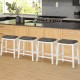 Single gray upholstered counter height bar stool with saddle seat and durable rubber wood frame, perfect for kitchen.