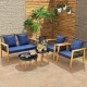 5-piece outdoor conversation set featuring navy cushions, acacia wood frame, and two coffee tables for backyard.