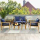 Elegant 5-piece outdoor conversation set showcasing navy cushions, acacia wood frames, and two coffee tables for.