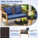 Navy blue cushions on a 5-piece outdoor conversation set with solid acacia wood and elegant PE rattan for backyard use.
