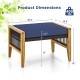 Navy cushion ottoman with acacia wood frame and rattan design, ideal for outdoor use as footrest or seat.