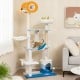 Multi-level ocean-themed cat tree tower in blue with sisal scratching posts, featuring a cozy hammock and playful fish.