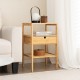 Bamboo nightstand with a slatted shelf and pull-out drawer, offering stylish storage for living room or bedroom.