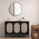 Irregular black wall mirror with a metal frame, perfect for enhancing indoor decor in living rooms or bedrooms.
