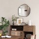 Irregular black wall mirror with metal frame, enhancing decor in living spaces, featuring rounded edges and easy.