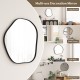 Irregular wall mirror with a black metal frame, perfect for living room or bathroom decor, featuring rounded edges and.