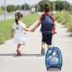Kids walking with a blue 16-inch hard shell carry-on suitcase featuring fun space-themed designs, perfect for travel.