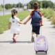 Kids walking with a pink 16-inch hard shell carry-on luggage suitcase, perfect for travel and adventures.
