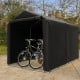 Outdoor bike tent with waterproof cover, 7 x 5.2FT, featuring a roll-up zipper door and sturdy metal frame for.