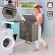 Gray 29-gallon laundry hamper with convenient handles, removable liner, and lightweight design for easy movement.