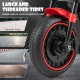 Large threaded tire of the Kids Electric Motorcycle, designed for various road types, featuring a red rim for style.