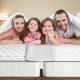 T-shaped bed bridge converter kit filling the gap between two twin mattresses for a seamless king size bed.