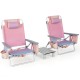 Two pink outdoor folding reclining chairs with a side table, featuring adjustable positions and cup holders for.