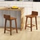 Set of 2 brown wood bar stools with solid back and seat, designed for comfort and stability at kitchen counters.